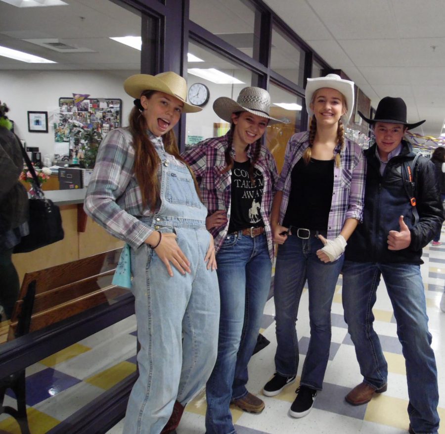 Howdy, pardners! Sisters Ryleah and Rainna Floyd join Abby Kokot and McClain Payne outside the attendance office on Cowboys versus Dinosaurs dress up day.  