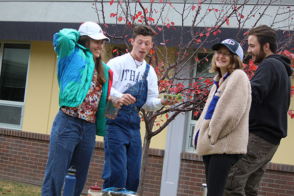 37 degrees and rain have not deterred the courtyard lunch crowd of Eva Molina, Gabe Nohl, Adam Lewis and Sophie Cajune, who are eating their lunch while standing on the courtyard benches Thursday. They are singing, you guessed it. Singing in the Rain.