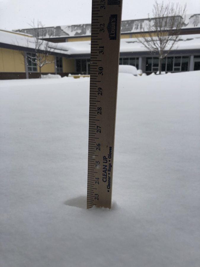 A+yardstick+in+the+courtyard+measures+how+much+snow+has+fallen+as+of+Tuesday+afternoon.