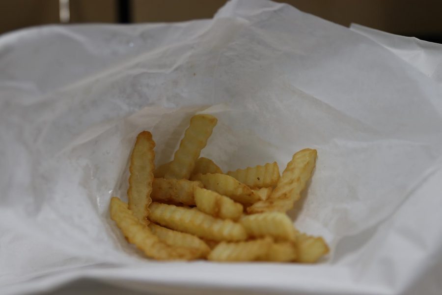 French fries from Mark’s In and Out, at right, are cheap and classic, but nothing to get excited about