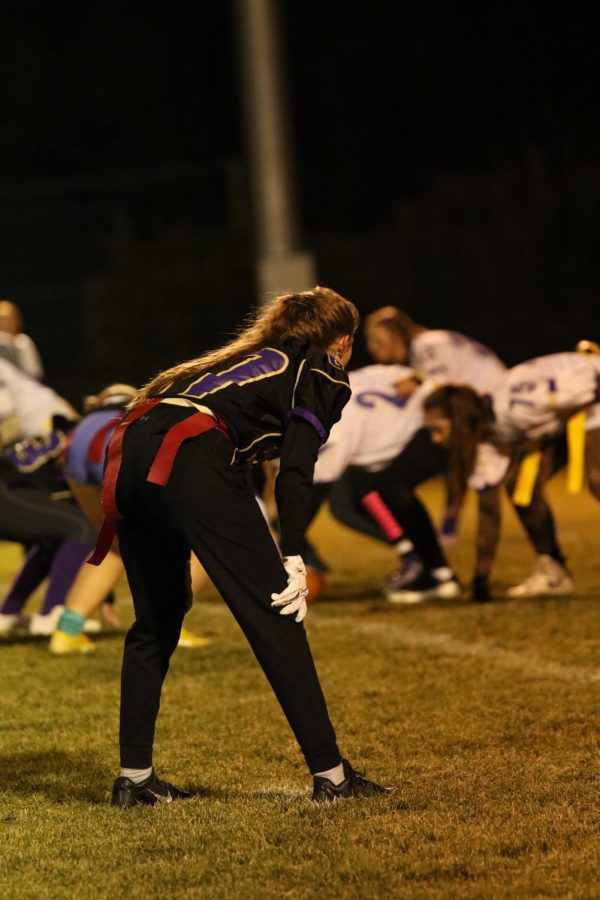 Ryleah Floyd preps herself for a play in the Powder Puff football game against the Juniors.
