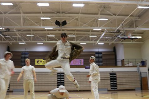 Brendon Johnson jumps over Chase Petrulis during their Back Street Boys dance routine
