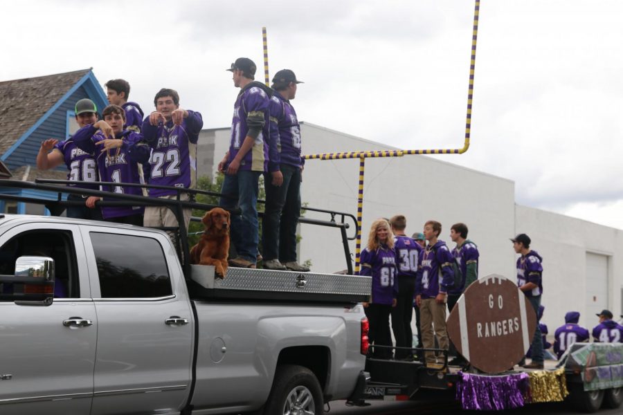 Park High football players show off their team float at the homecoming parade.