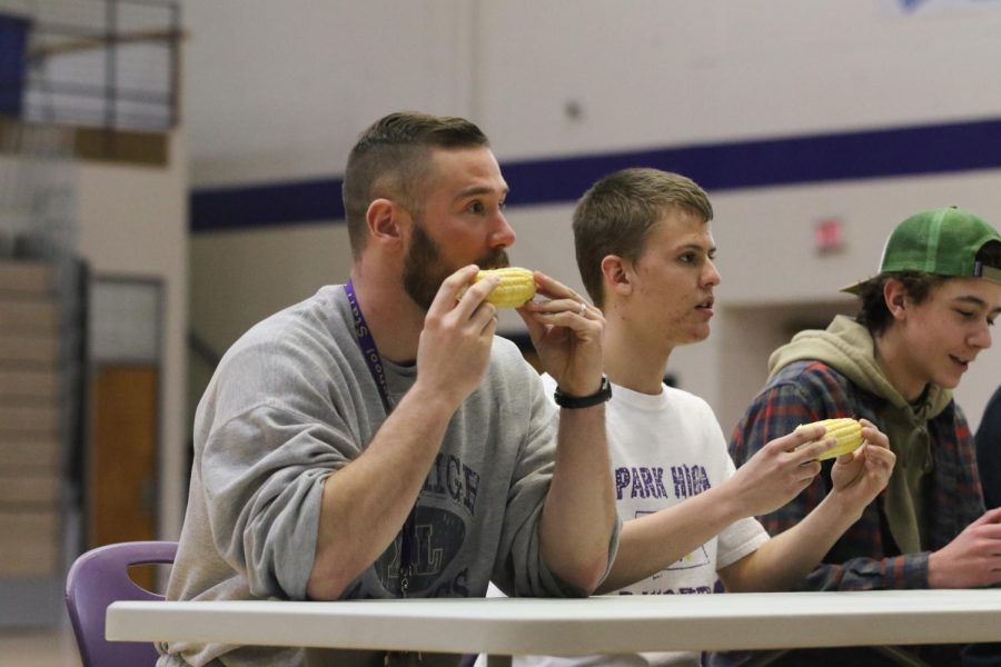 Teacher Ben Hahn participates in the Corn eating competition 