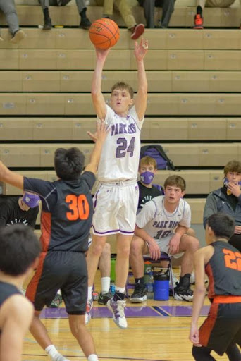 Casey Miller shoots a three against Hardin at home. 