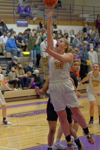 Kodie Vondra jumps high to shoot against Hardin. 