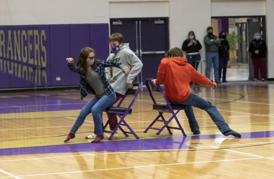 Alejandra Kaliher-Tirado,  (left), Ryan Bauer (center), and Mathias Greer (right) are among the first students to take a chance at competing in a round of musical chairs.