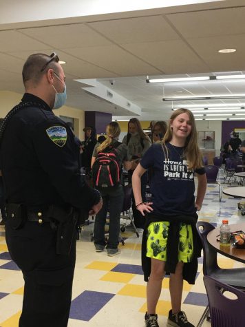 Officer Chris Gentile talks with student Jasmyn Meyer during lunch last week.