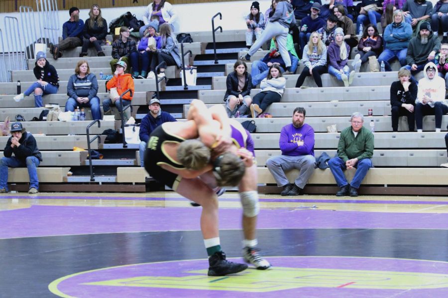 Tucker Shepardson hip tosses into the mat.
