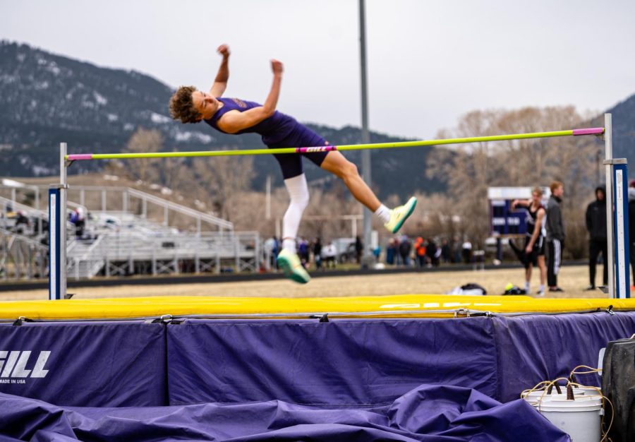 Ryan Miller clears the bar during high jump at the home track meet April 21.
