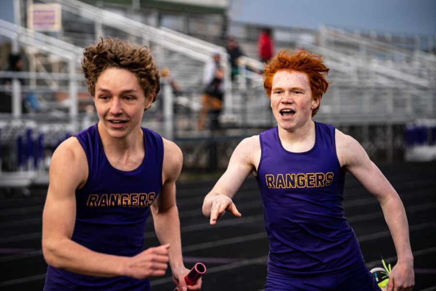 Tyler+Grenier+stretches+to+handoff+to+Ryan+Miller+in+the+4x4+relay+at+the+home+track+meet+April+2%601.