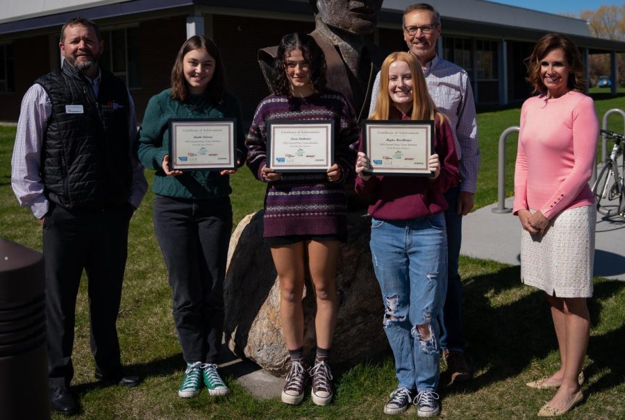 Ryan Anderson of First Interstate Bank stands with the Park High team who took second place in the Montana Economics Challenge contest: Annika Coleman, Severn Sienkiewicz, and Haylee Harshbarger. Matt Jones of Montana Rail Link and advisor Joey Lane are on the right.