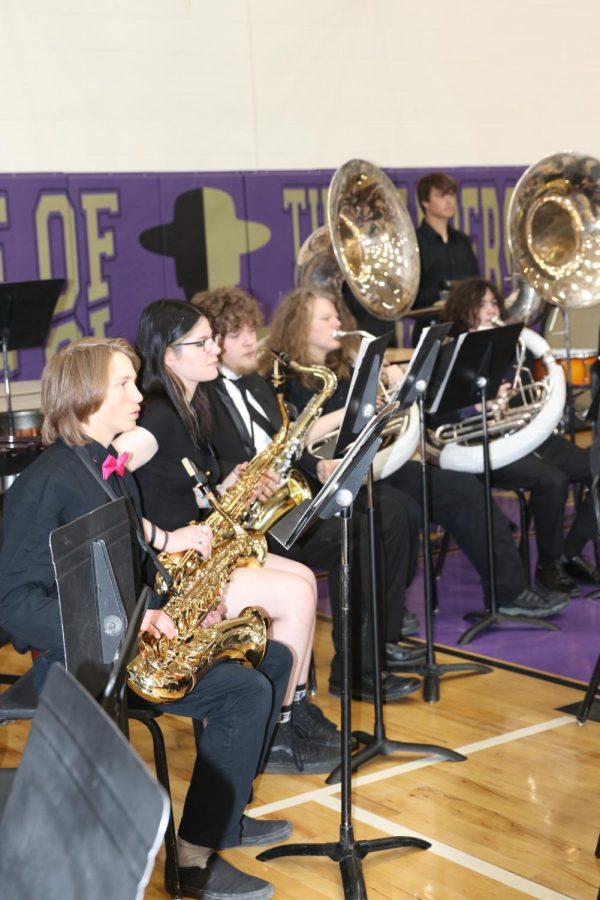 August Stern, Dakota Marie Burgess, Rowdy Mitchell and Austin Maynard play in the band before the graduation ceremony starts.