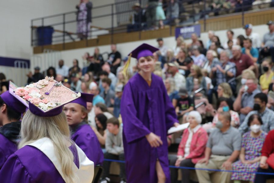 Carl Beardsley smiles as he returns to his seat after receiving his diploma.