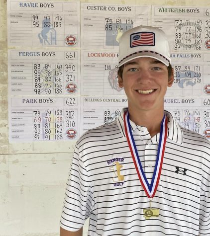 Aubrey smiles big after taking home gold for the 2022 golf season.