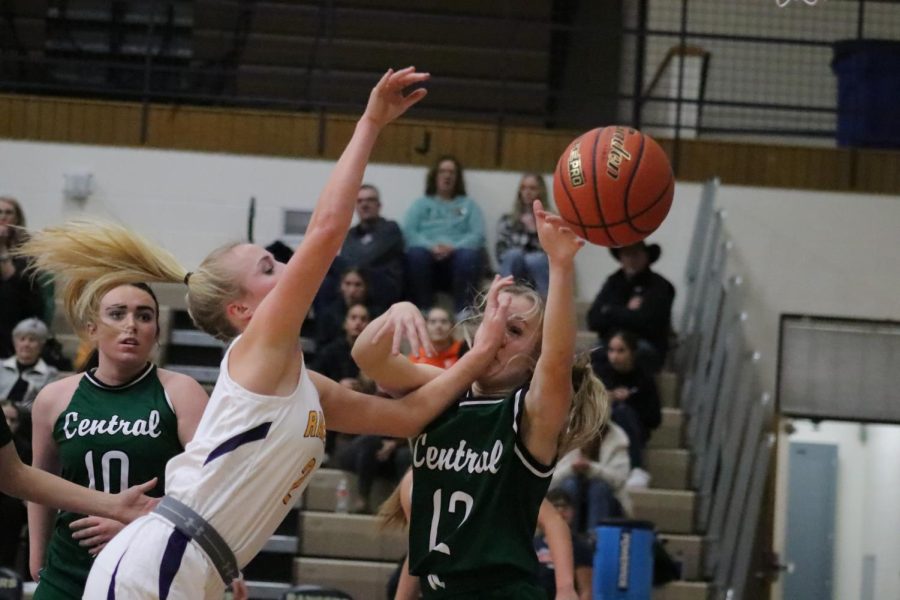 Maya Stenseth going up for a rebound against number 12 on Billings Central