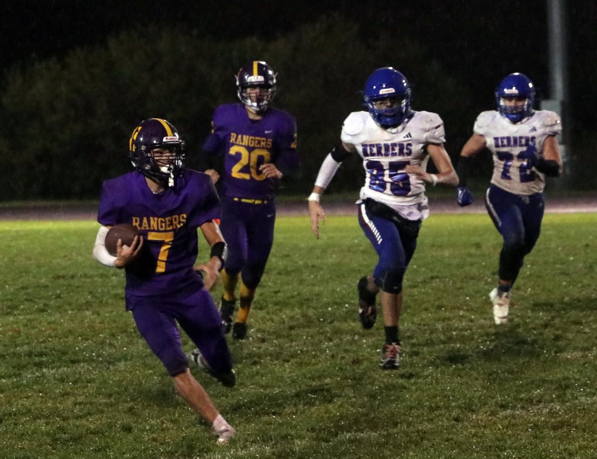 Quarterback Ryan Miller charges down the field in the 33-0 victory over the Herders.
