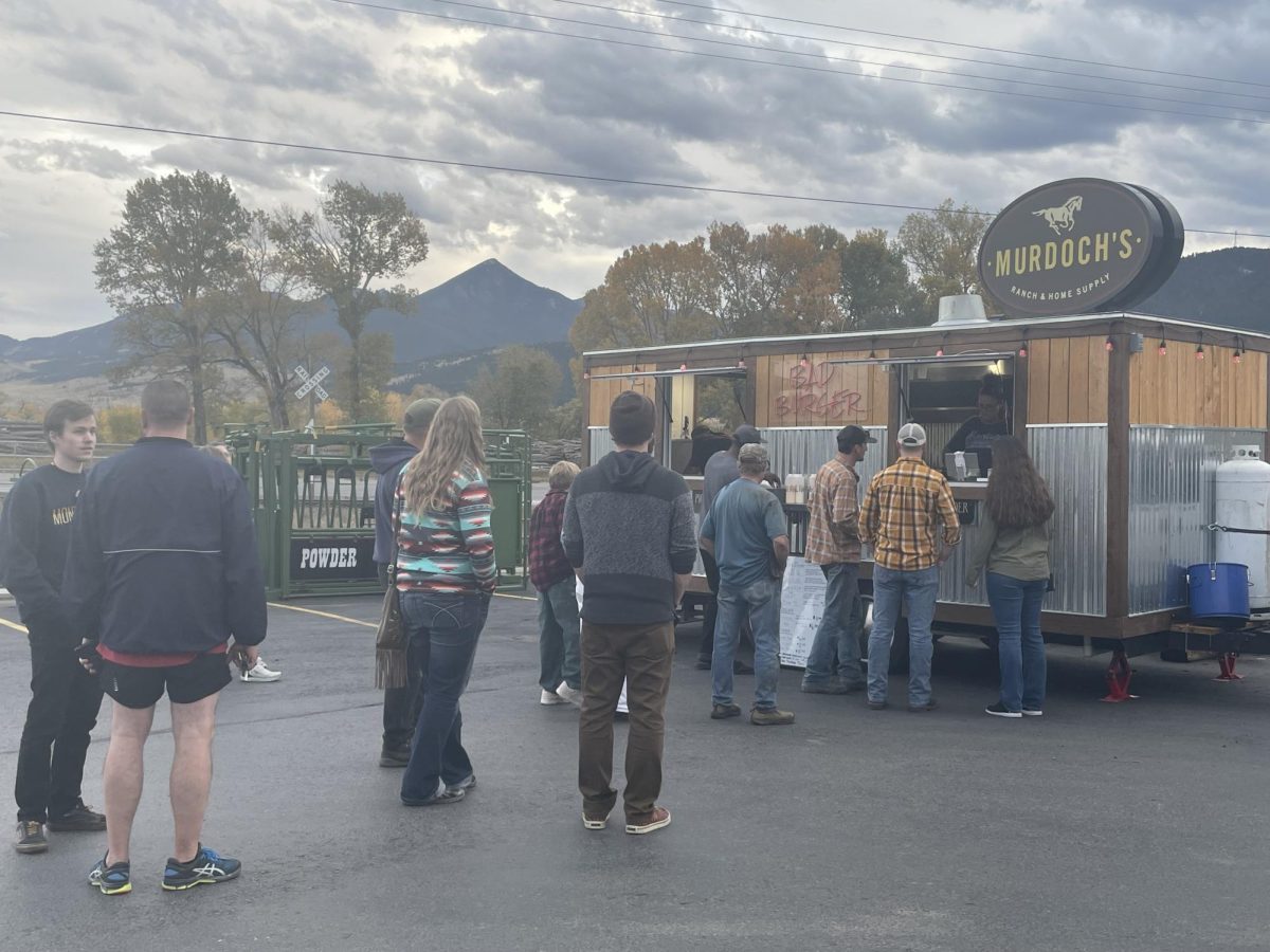 People line up in front of Bad Burger in the Murdochs parking lot. 