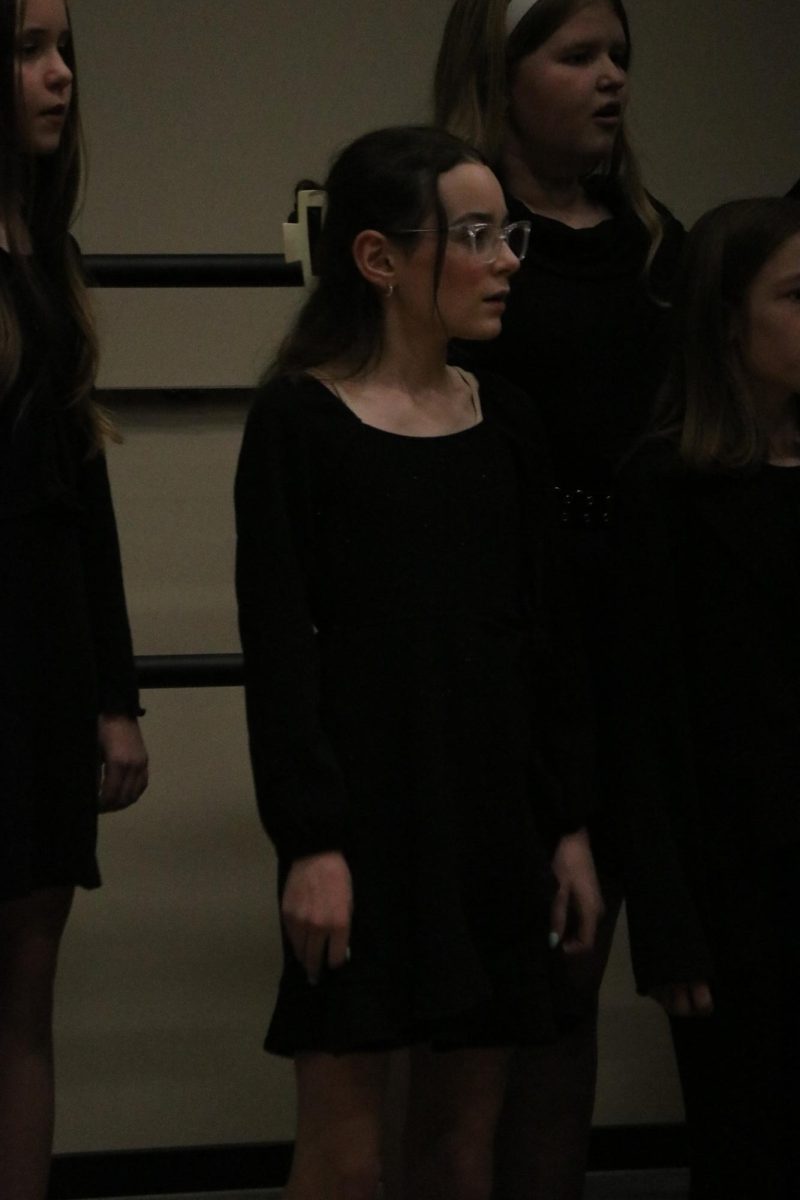 Sixth grader Julia Lende sings in the Peace I Leave You number with her choir, directed by Garrett Stannard.