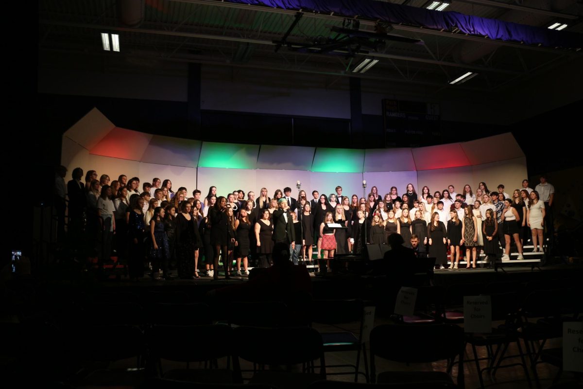 All middle school and high school choirs sing together. 
