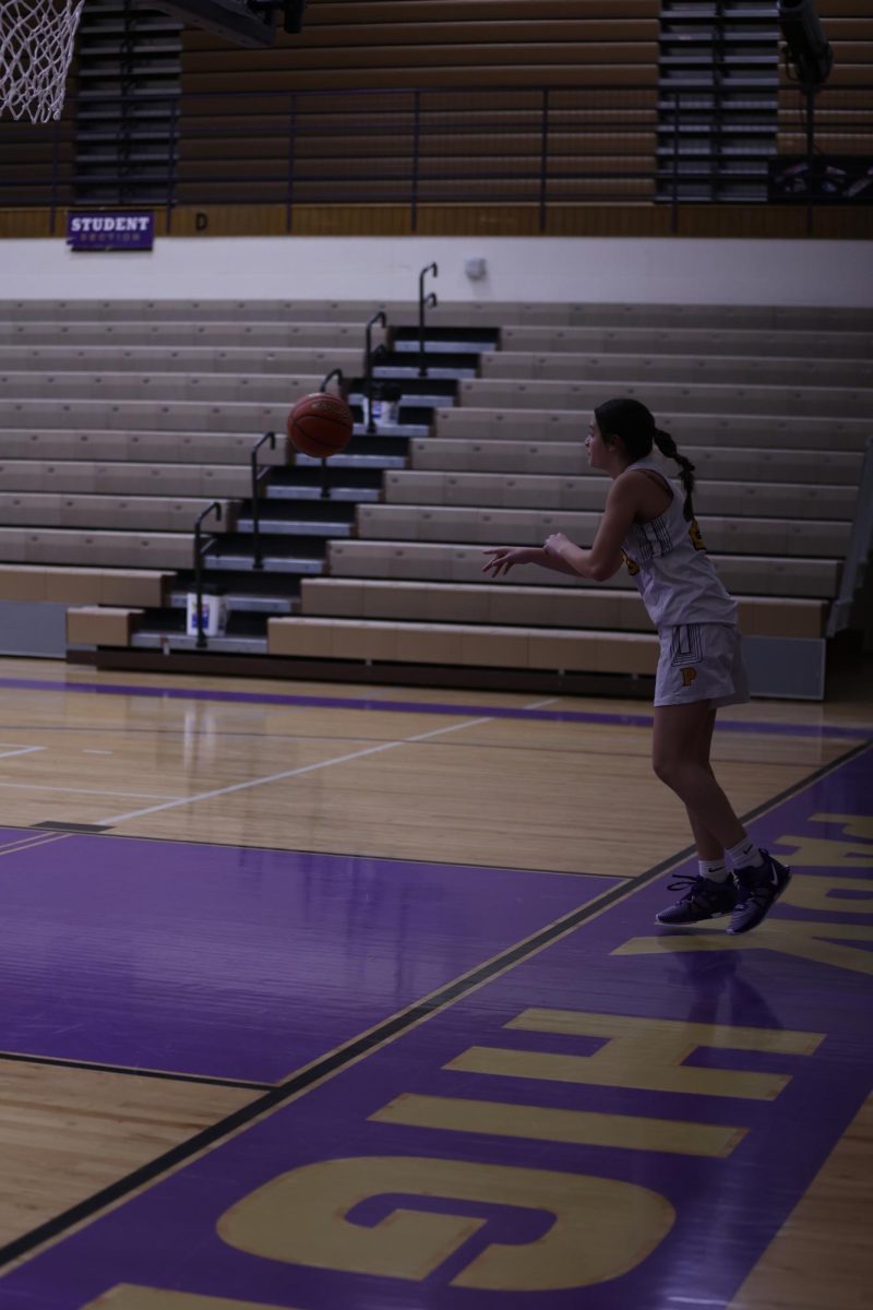 Junior Megan Ruebusch throws ball in from out of bounds. 