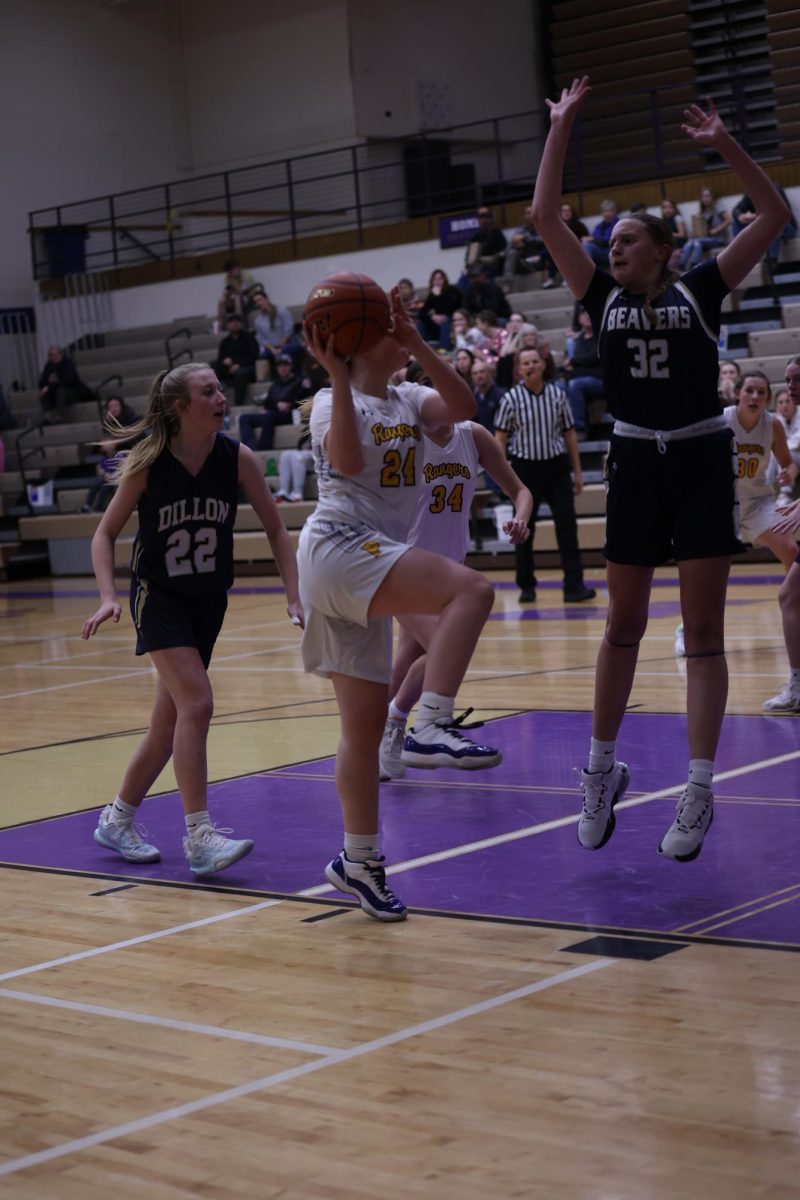 Point guard Alivia Duffy goes up for a contested layup.