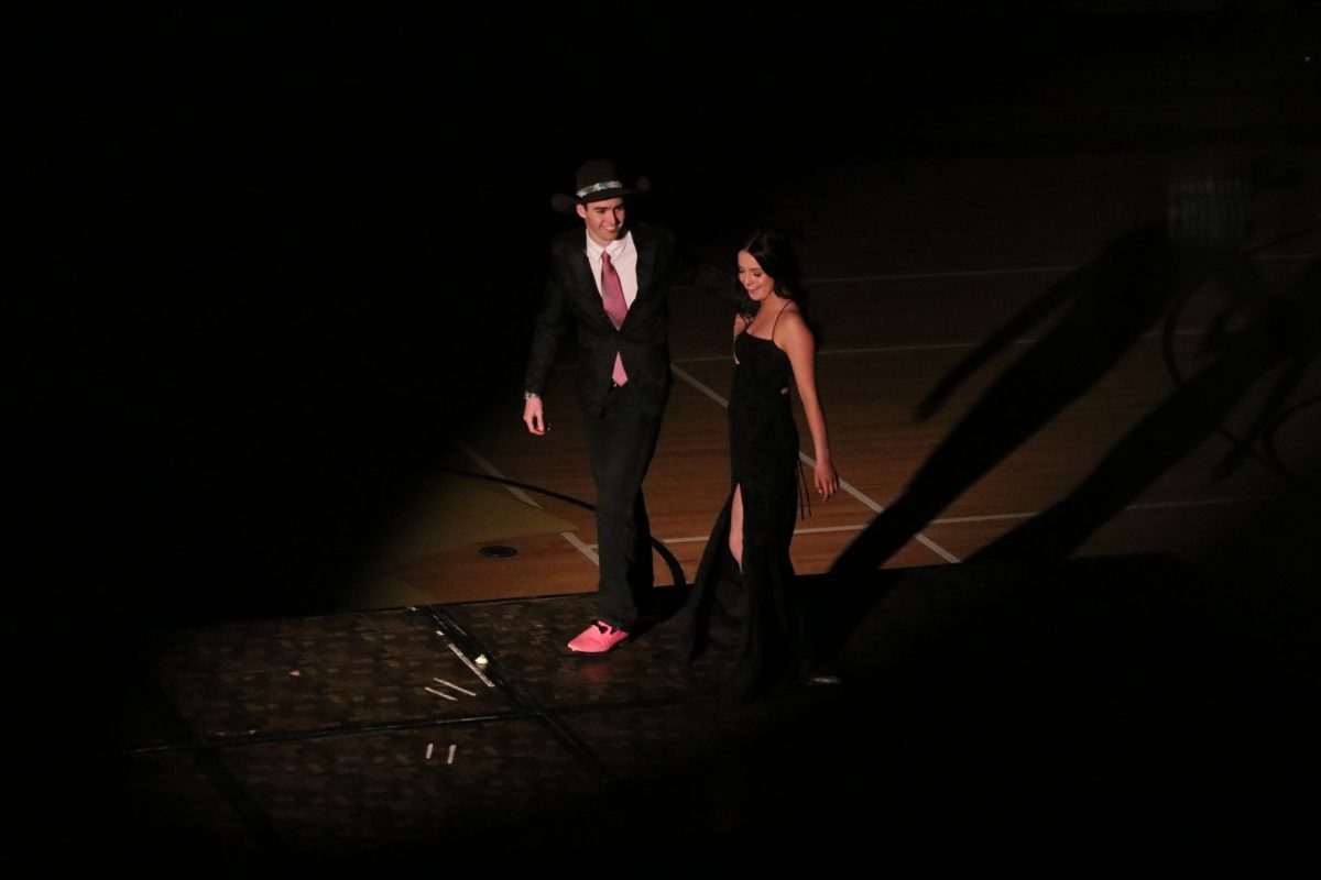 Kiris Hogland Mossman and Paul OHair walk hand in hand off the stage at formal on Feb. 17th.