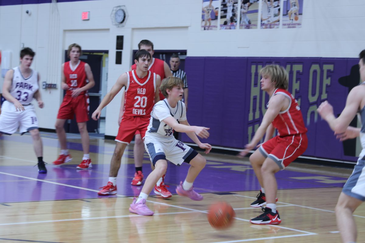 Myles Young, eighth grader, passes the ball out to Cameron Sestrich on the 3-point line.