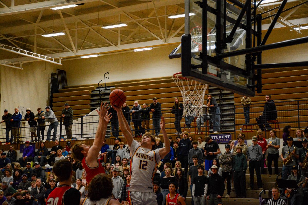 Senior Alec Dalby fights for a rebound. Dalby played in his final home game on Saturday night.