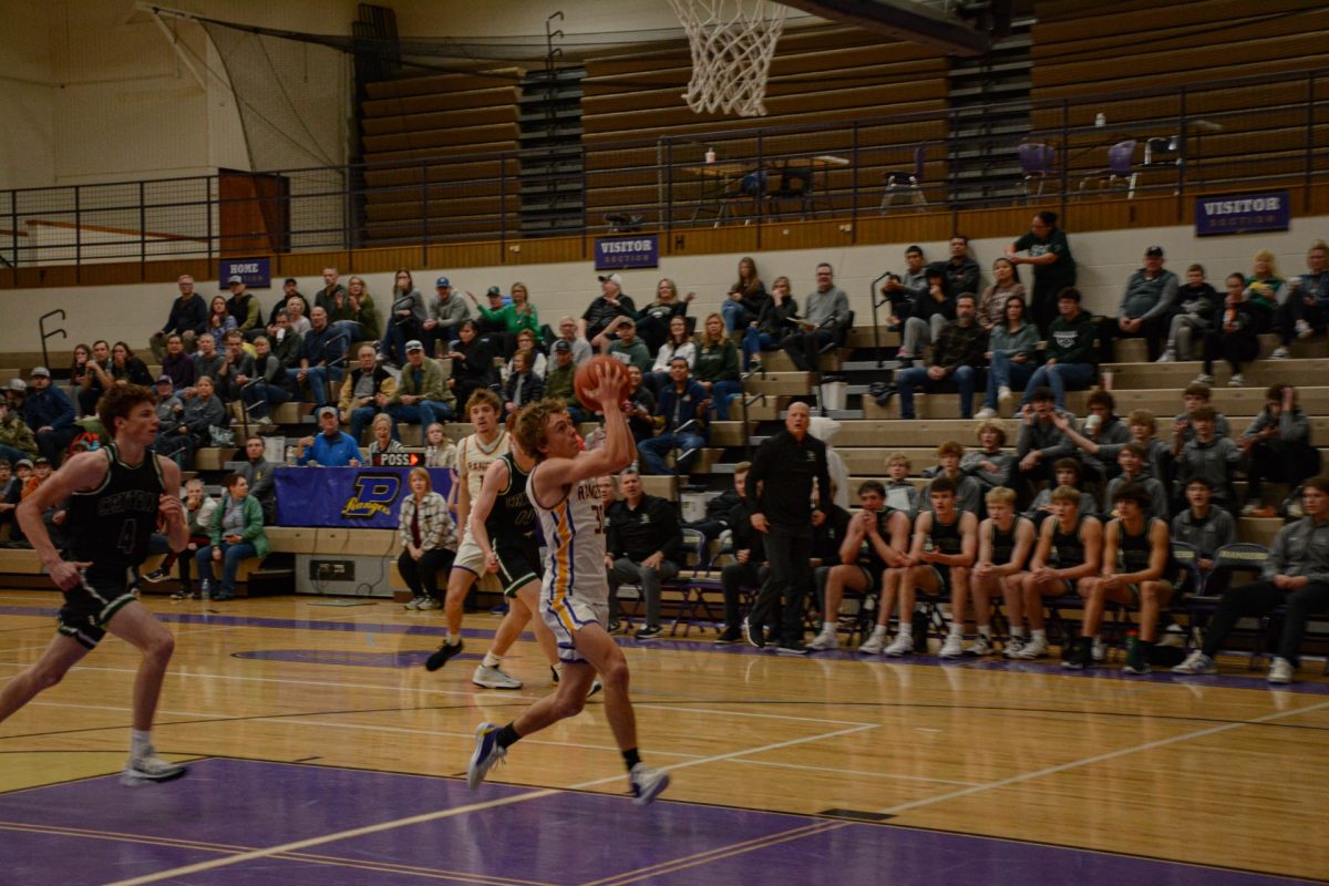 Senior Kimball Smith receives the ball on a fast break opportunity for the Rangers versus the Billings Central Rams. Smith would complete the fast break to boost the Ranger’s score.