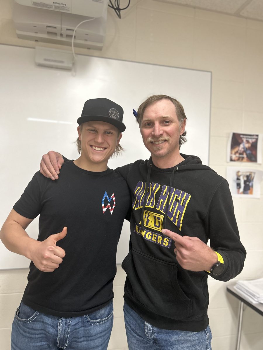 Kyan Meservey, standing with his teacher Kyle Neibauer, suggests asking at least one teacher for a letter of recommendation when applying for scholarships.