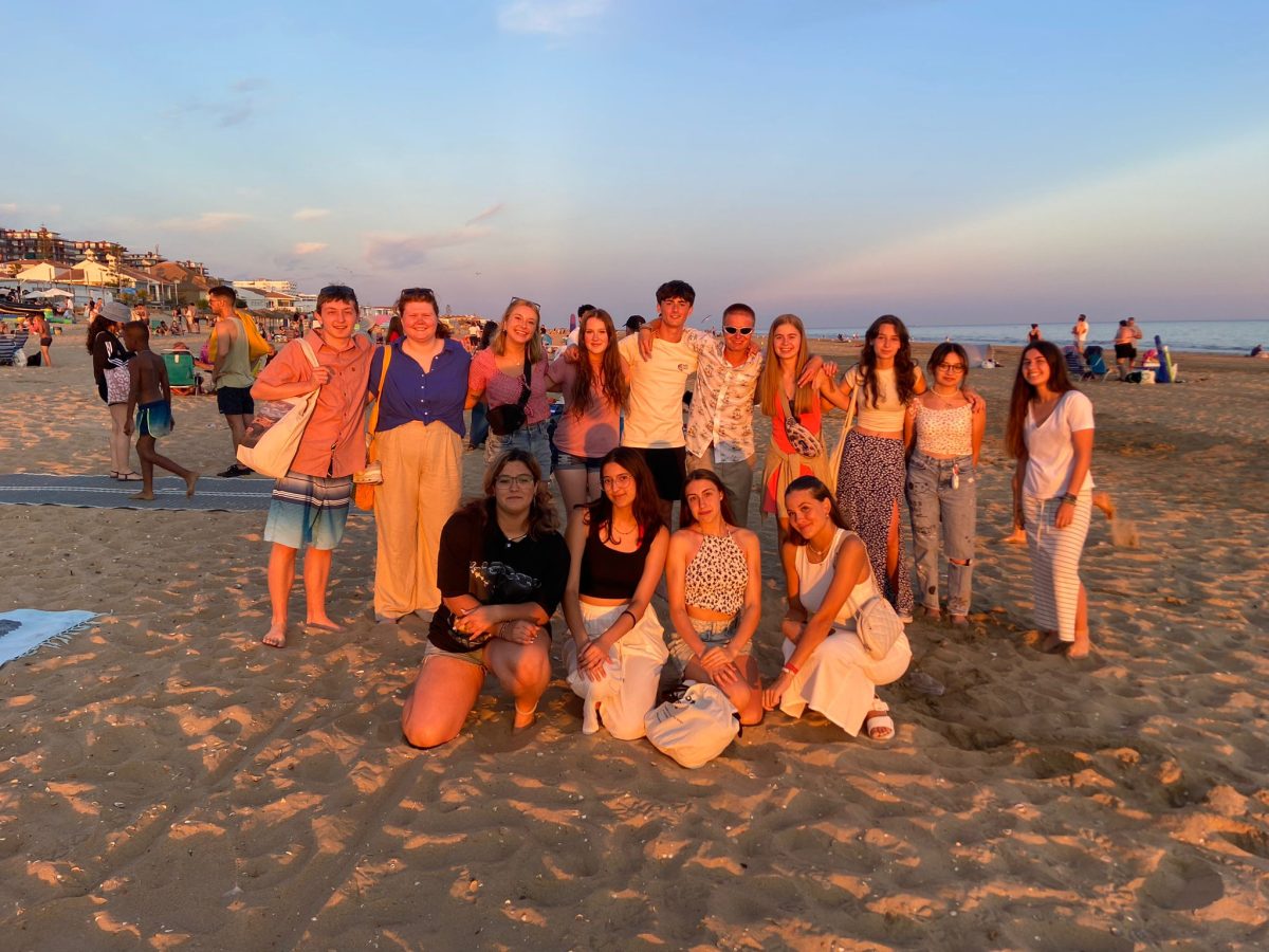 Park High students stand on the beach in Spain with their host siblings this summer.