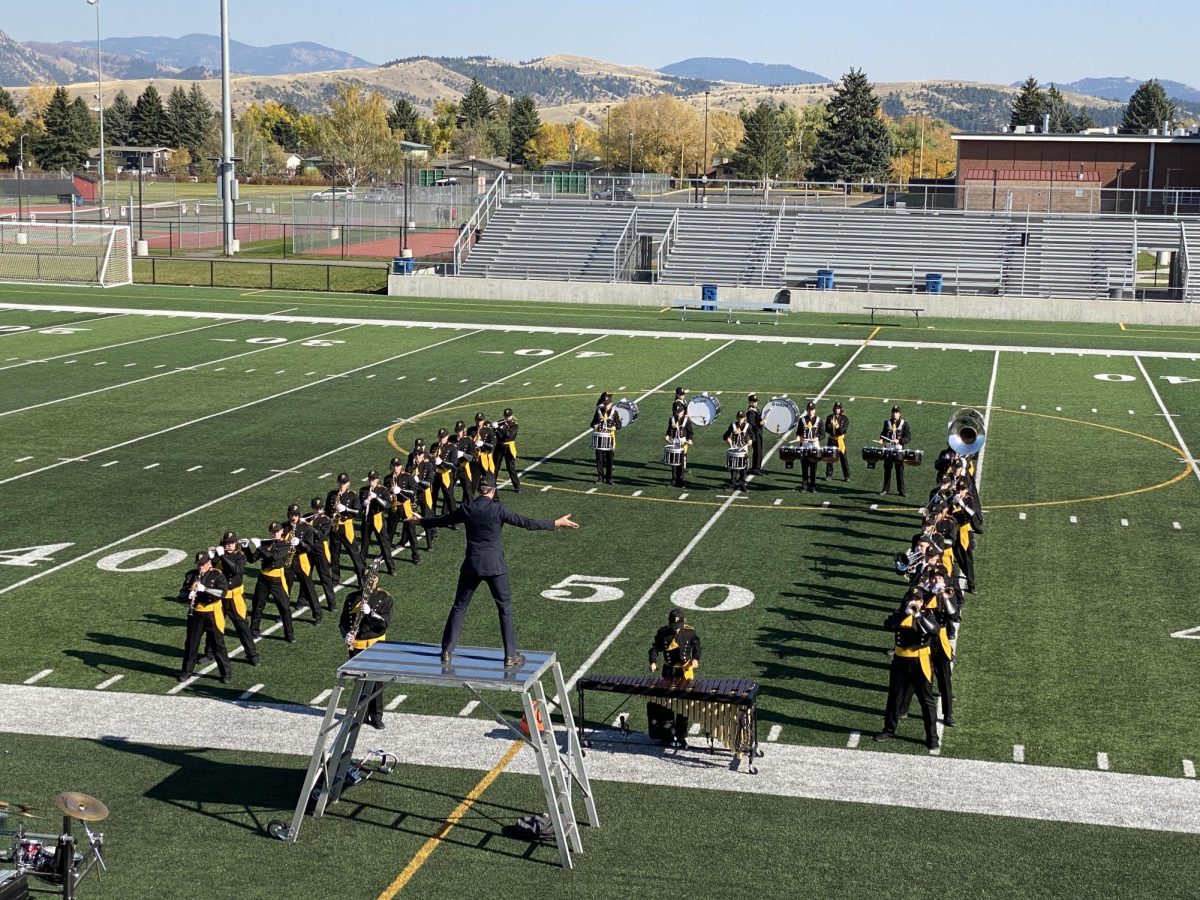 Garrett Stannard directs the marching band Saturday, Oct. 12 at the Bozeman High School marching band bash.