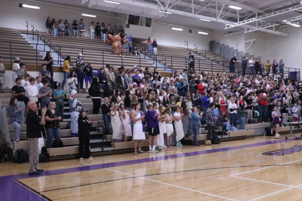 Park High students gather in the gym for the homecoming assembly, including a group of seniors in their togas.