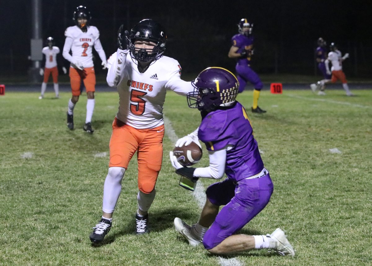 Junior Turner Bolton victoriously catches the ball after a lengthy throw by Paxon Sikkink.