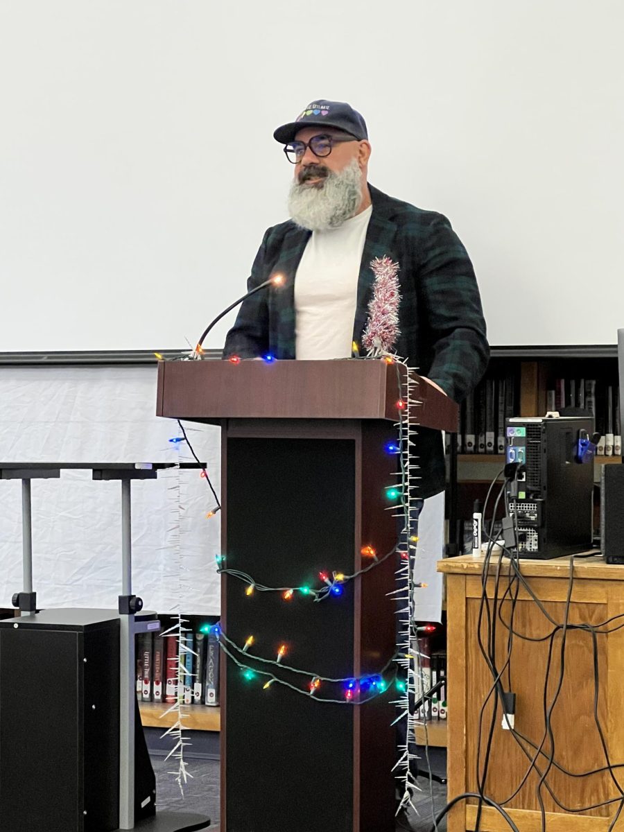 English teacher Kelly Dick compliments his students on sharing their original holiday poems.