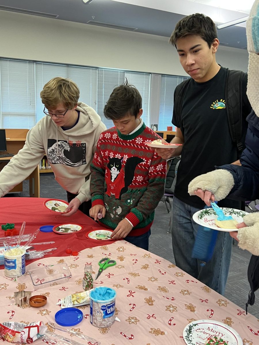 Chase Alt, Braden Windham and Joji Berg decorate cookies.