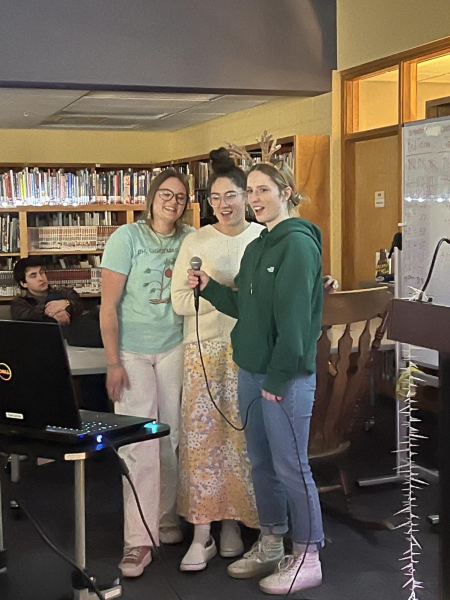 Kenna Benzel, Quinci Wood, and Tess Goosey sing "I Want a Hippopotamus for Christmas" during 7th period karaoke.