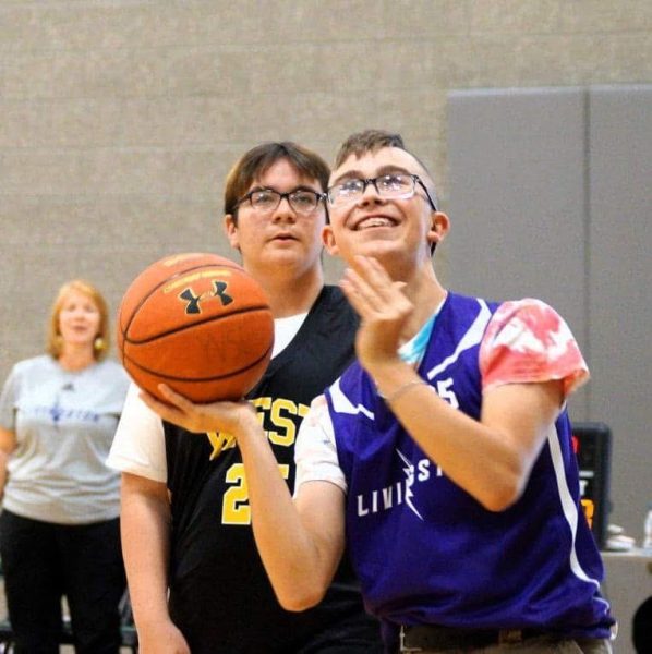 Silas Fish smiles at the basket before taking a shot