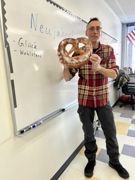 German teacher herr VonSehlen has a "neujarhsbrezel" or more known as a new years pretzel to help the German students welcome the new year.