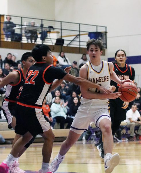 Junior Coen Braham (0), dribbles past a hoard of defenders