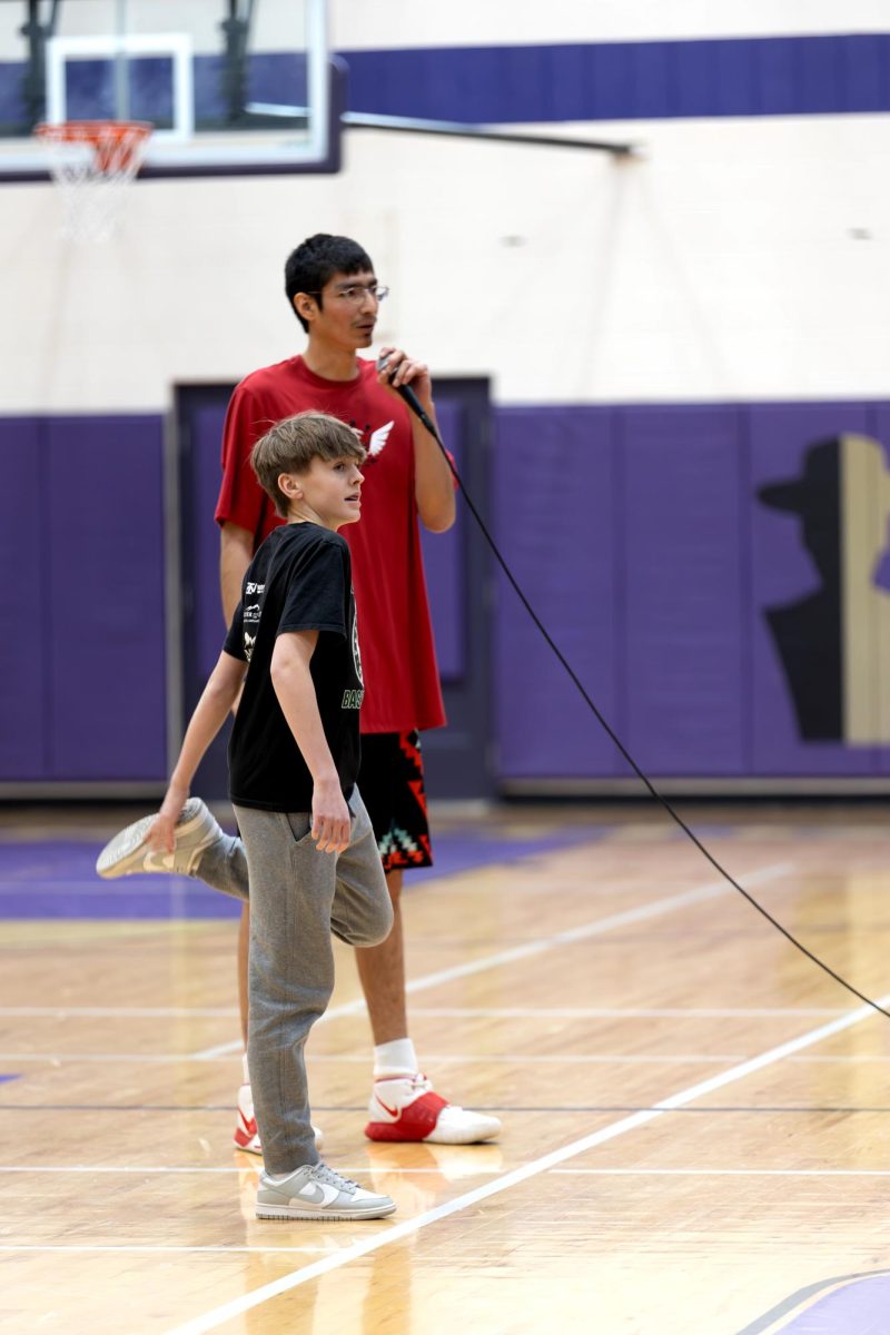 Isaac Fisher stands with freshman Calvin Blueher before the 3v3.