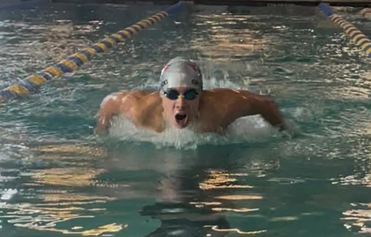 Sophomore Joji Berg competes in the 400 intermediate medley at the Butte YMCA Feb. 22.  "I think I placed eleventh in state," he said, explaining that swim clubs from across the state competed this weekend in Butte.