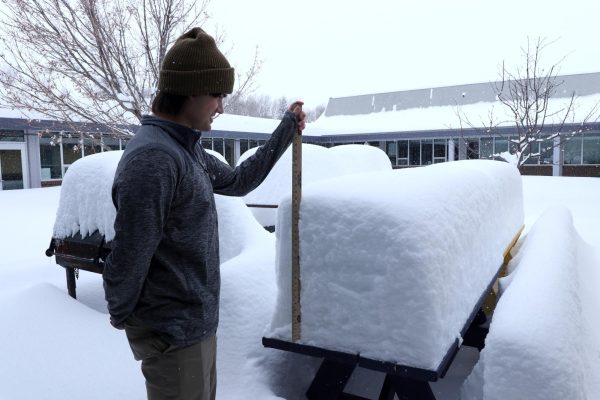 Geyser reporter Logan Jergenson measures two feet of snow in the courtyard, with more still falling.