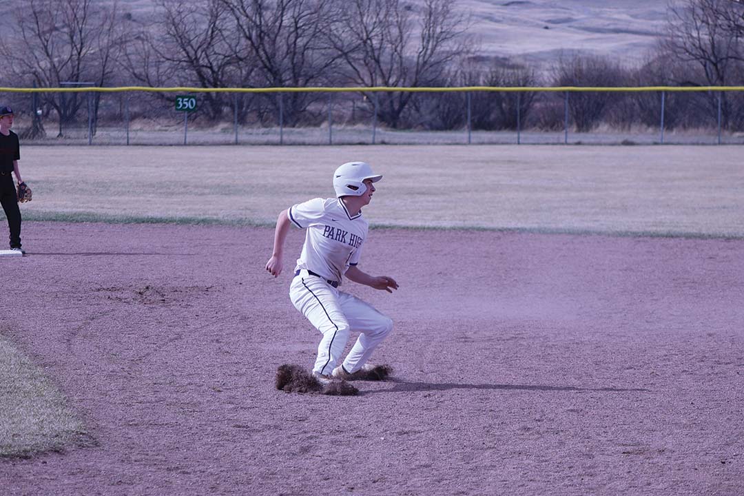 Junior Weston Vincent takes off to second base after the ball flies into the out field