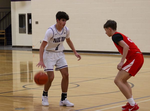Point guard Brody Leininger dribbles as he moves in to shoot against Lockwood.