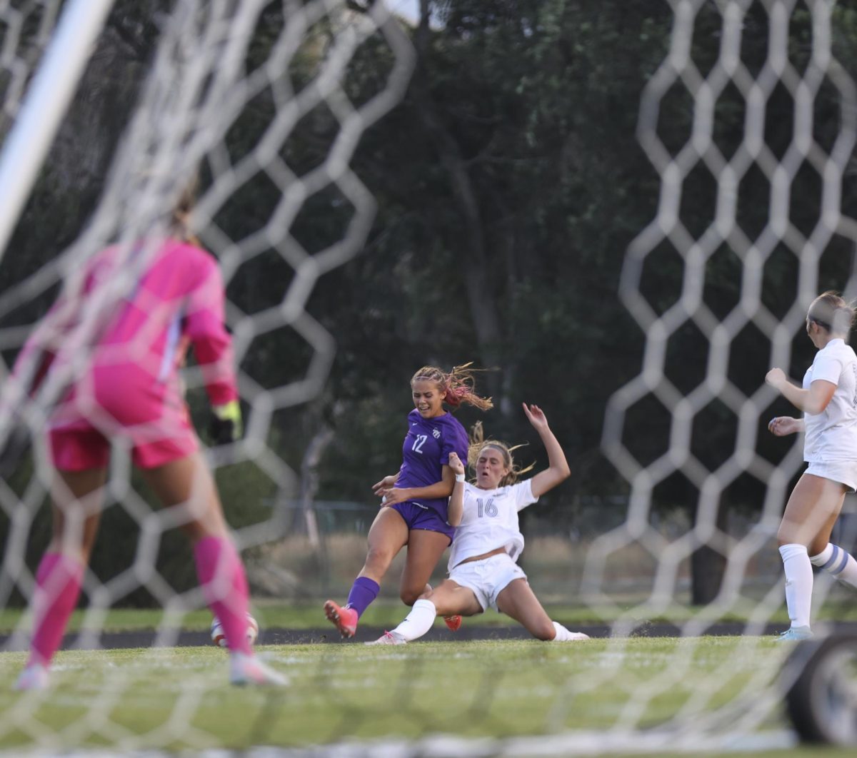 In a close matchup against Big Sky, Phoebe Alverson (12) goes for a pivotal goal late in the game.