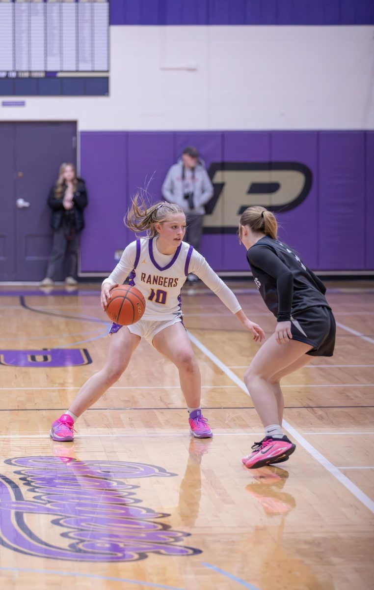 Point guard Annie Keyes looks to crossover.  "Annie is a key defender on our team," junior Maria Turck said.