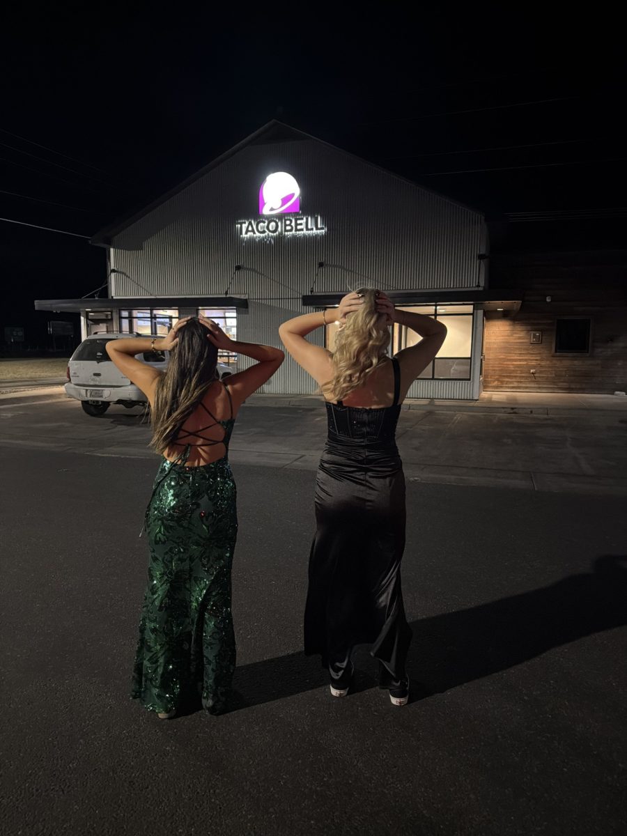 Bella Fabich and Lizi Harvey-Lilley enjoying the view in front of Taco Bell.