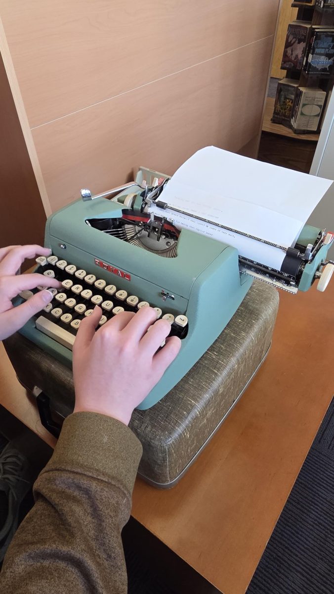Hunter Case typing on the typewriter
